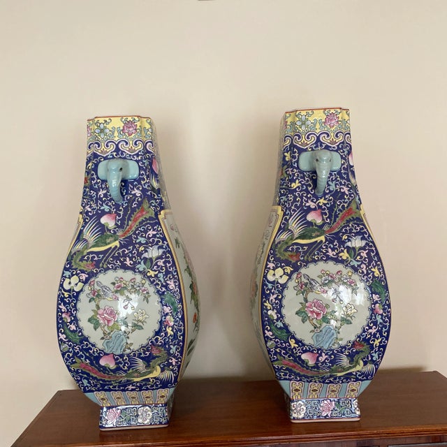 Beautiful pair of hand painted oversized Asian jars, beautiful floral motif with awesome colors! Subject matter includes...