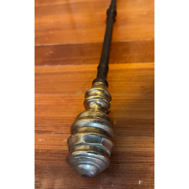 Antique early 19th century American Federal brass and iron fireplace poker circa 1800 - 1820. Wonderful brass finial with...