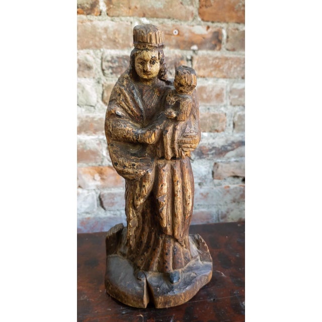 We are selling this religious carved Santos figure of the Madonna and Child. The figure is probably late 19th century and...