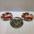 Offered is a collection of 3 Fitz and Floyd hand decorated fine porcelain holiday plates. Two plates in pattern "Christmas...