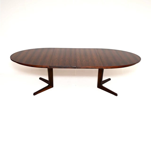 A stylish and top quality Danish vintage extending dining table by Bernhard Pedersen, made in Denmark and dating from the...
