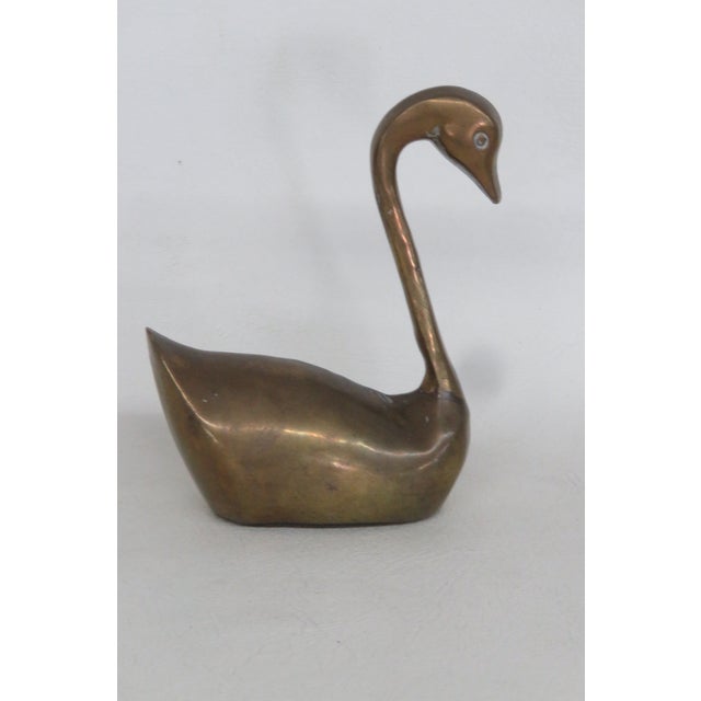 This highly charming Swan Figurine is made out of brass. This adorable metal swan figurine presents a highly elegant...