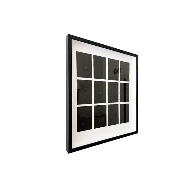 Modern abstract grid artwork created on wood with gesso, featuring a structured multi-panel composition in deep black and...