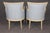 Elevate your interior with this exquisite pair of French Louis XVI style bergère chairs, masterfully crafted with elegant...