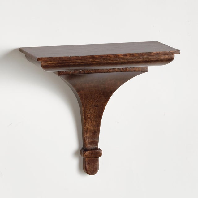 This corbelinspired mango wood wall bracket is the ultimate decorative shelf. Perfect for displaying your favorite plant,...