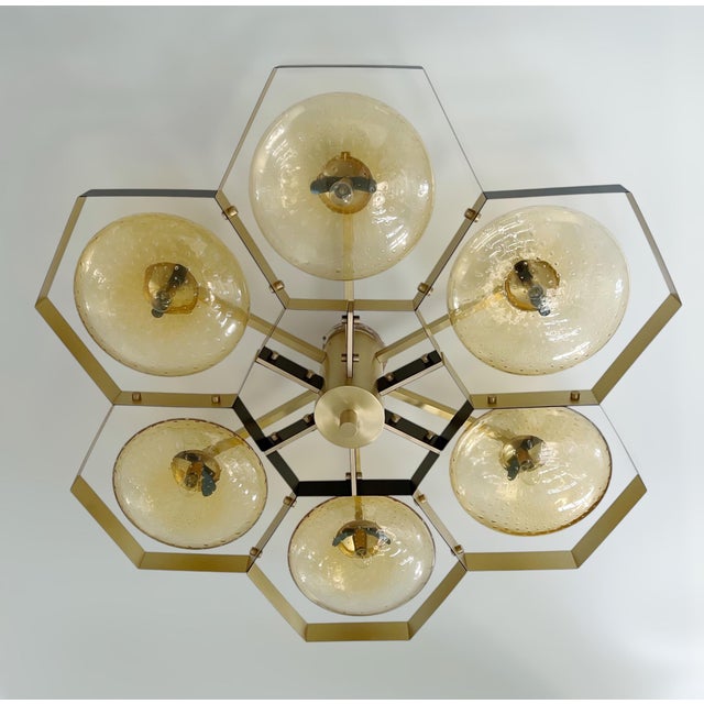 Italian midcentury flush mount with six amber Murano glass shades carefully hand blown with bubbles inside the glass using...