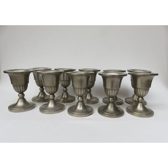 This set of ten ceiling lights were crafted in the late 19th or early 20th century. They are made of brass and porcelain...