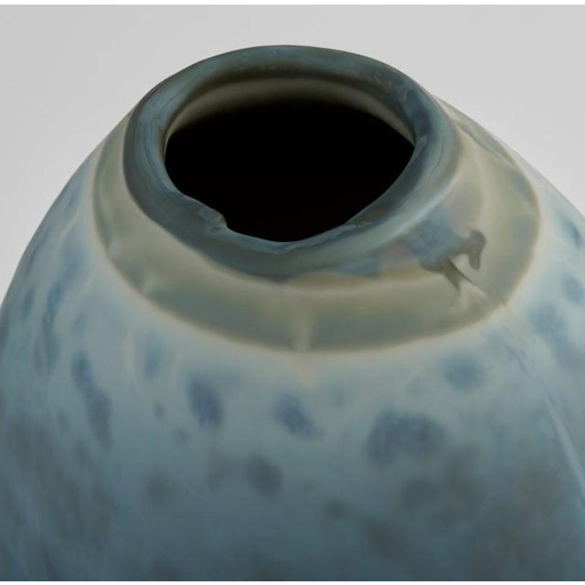 Tiedye Vase | Milky Matte Blue – Small A reactive glaze interacts with the blue tones on the vases, creating unique...
