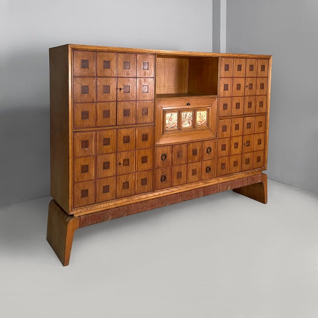 Italian sideboard by Gio Ponti in wood, polychrome decorative tiles, 1930s Rectangular highboard or sideboard in wood. The...