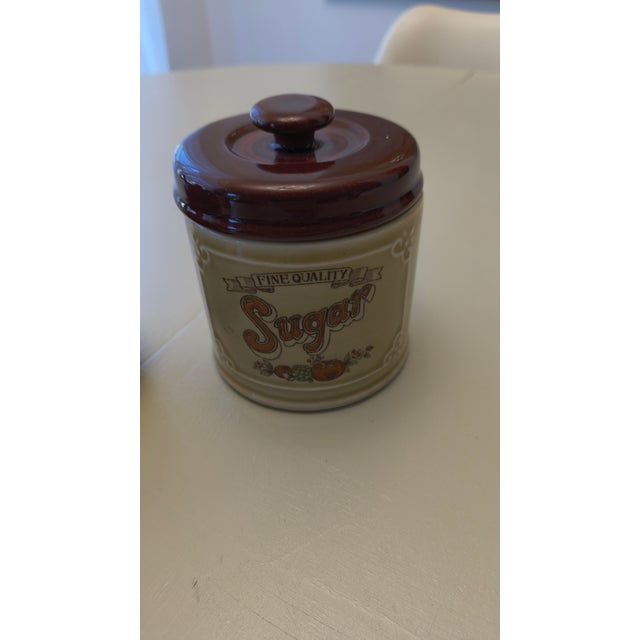 Vintage Hull Pottery serving set featuring a lidded sugar bowl and matching open condiment/jam bowl in the iconic brown...