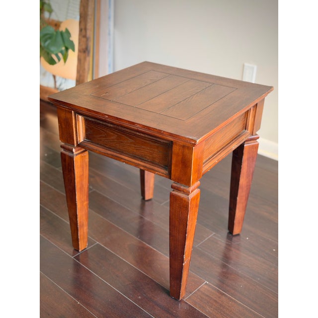 A beautifully proportioned Georgian Revival mahogany lamp table featuring a paneled top, molded apron, and architectural...