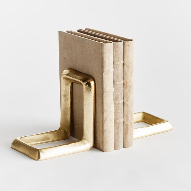 Are they bookends or objects? You decide. Made of solid aluminum, this substantial pair can be arranged in a number of...