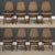 A set of eight mid century modern teak high back dining chairs with beige upholstered backs designed by Bruk Sorheim for...