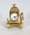 Charming gilded bronze pendulum with slightly rounded edges, whose facade is adorned with relief floral compositions. This...