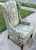 Beautiful midcentury wingback chair with alternating stripes and neoclassical themes of overflowing urns and scrolling...