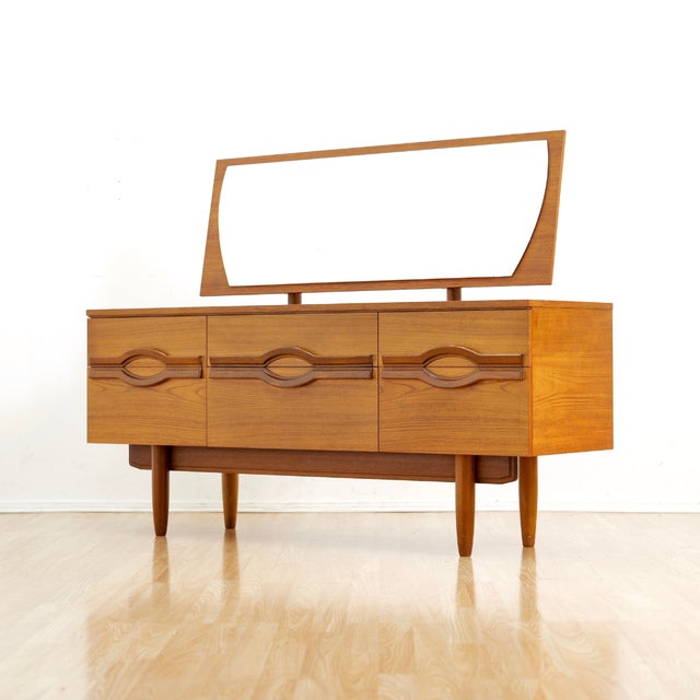 This stunning mid-century dresser vanity was produced by Stonehill Furniture during the 1960s. A cleanly designed dresser...