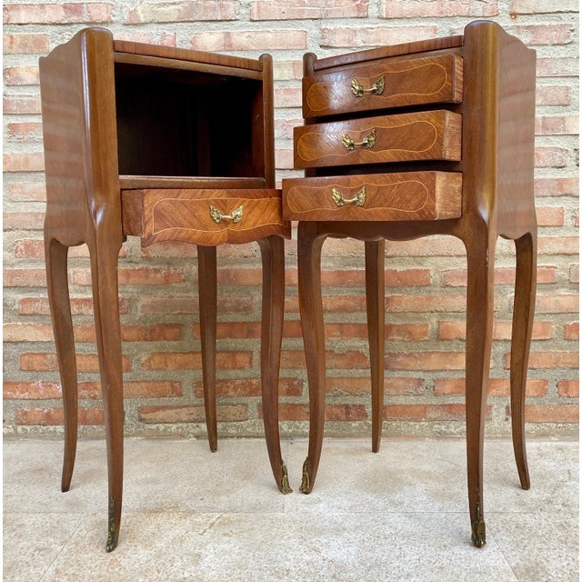 Elegant pair of French bedside tables in the Louis XV style, dating from the mid-20th century. Crafted in fine hardwood...