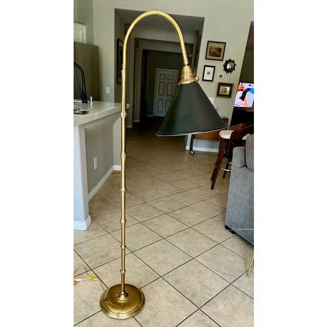 High quality vintage faux solid brass bamboo floor lamp with black metal tole swivel shade, by Frederick Cooper. The brass...