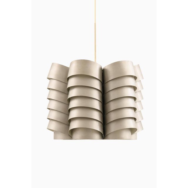 The tn 42 ceiling lamp, designed by hans-agne jakobsson and produced by hans-agne jakobsson ab in markaryd, sweden during...
