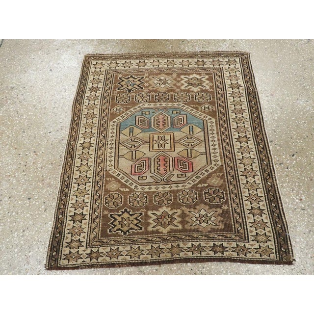This Early 20th century Caucasian Shirvan rug, measuring 2' 2" x 2' 7", is a striking example of the region’s celebrated...