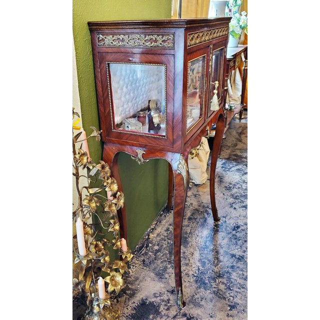 Presenting a beautiful and elegant 19th century French Boudoir vitrine in the style of Louis XV. From circa 1890 and made...