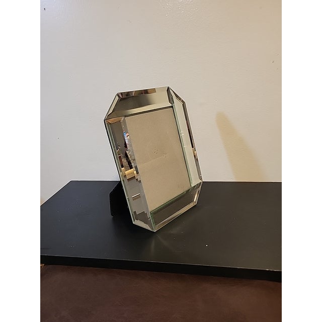 Unmarked mirrored art deco style picture frame. This would look just as good hanging on a wall as it does sitting on a desk.