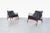 Stunning Danish modern leather lounge chairs by Ib Kofod Larsen for Selig in Denmark, circa 1950s. The sculptural frames...