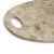 Carved from natural mineral, this oval board is smooth to the touch and rich in cream tones: marbled, veined, and striated...