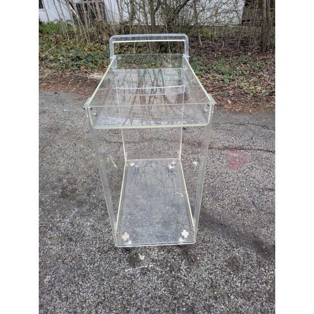 Lucite bar cart. Great for storage and service. Use as a tea service cart. Easy mobility.