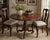 A handsome early 20th-century antique pedestal table featuring a distinctive octagonal top and beautifully figured warm-...