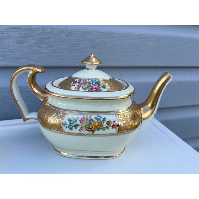 This is a very rare exquisite set from an era where elegance reigned. These pieces were manufactured in England by Cauldon...