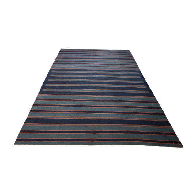 This vintage 6x10 Dhurrie flat weave is an exciting new entry in Rug & Kilim’s esteemed collection. Handwoven in wool, it...