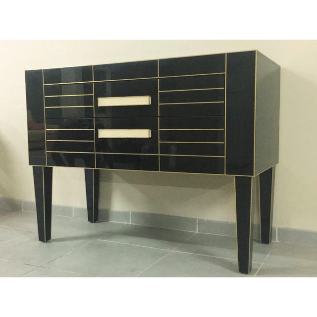 About Beautiful and elegant black mirrored commode. Spectacular ivory glass handle. Two-brake drawers. Oakwood furniture...