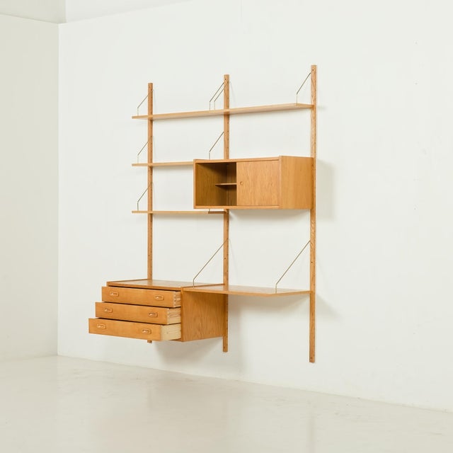This rare danish mid-century oak wall unit was designed by preben sørensen and manufactured by ps system in randers in the...