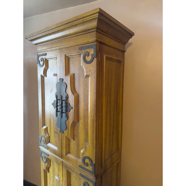Spanish Mediterranean / Spanish Revival tall four-door cabinet, likely 1960s–1970s. Solid wood construction (oak or pine)...