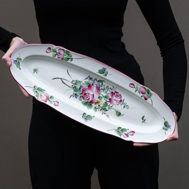This extraordinary long oval serving platter by Luneville is a testament to the elegance of early 20th-century French...