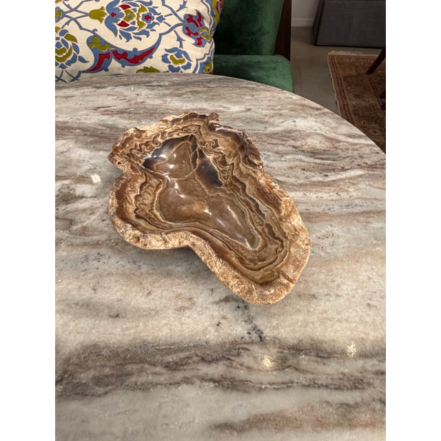 Free form alabaster catchall dish. The amorphous shape combined with the stripes of the layers gives great depth to this...