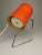 Rare minimalist table lamp from around 1960 with a lampshade made of orange-red cardboard. European Plug (up to 250V).The...
