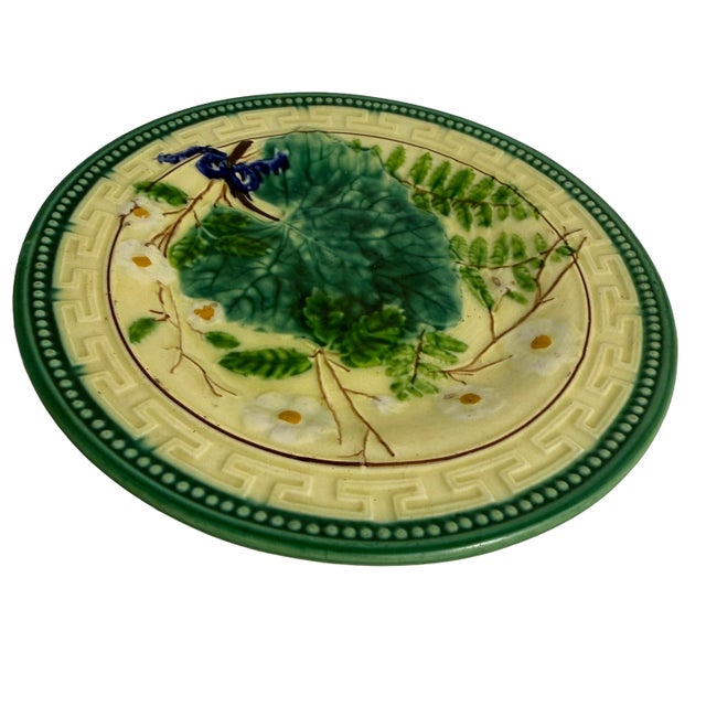 A beautifully modeled Hornberg majolica plate featuring raised leaves, ferns, and floral motifs on a creamy ground. The...