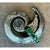 This vintage brooch is sculpted in silver-tone metal into a bold, asymmetrical spiral form, its textured surface finished...