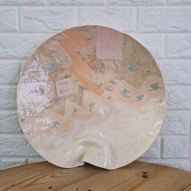 A decorative handmade ceramic plate by Barbary Demery. Covered in playful pastels, unique glaze combinations, and...