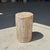 Small side table in white, gray, and beige petrified wood. Petrified wood is a fossilized wood (from the same family as...