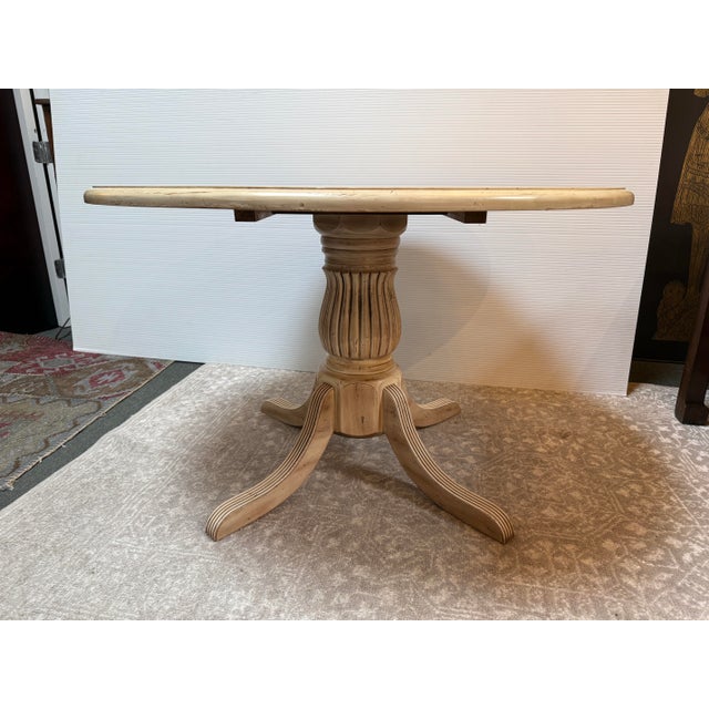 Design Plus Gallery presents a Breakfast Pedestal Table from Sunrise Home. The table offers a French country aesthetic...