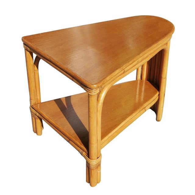 Two-tier stick rattan corner side table with a Mahogany tabletop. A great example of early modern rattan design, circa...