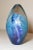 Up for sale is a gorgeous hand blown Robert Eickholt art glass paper weight done in 1993. This egg-shaped paperweight is...