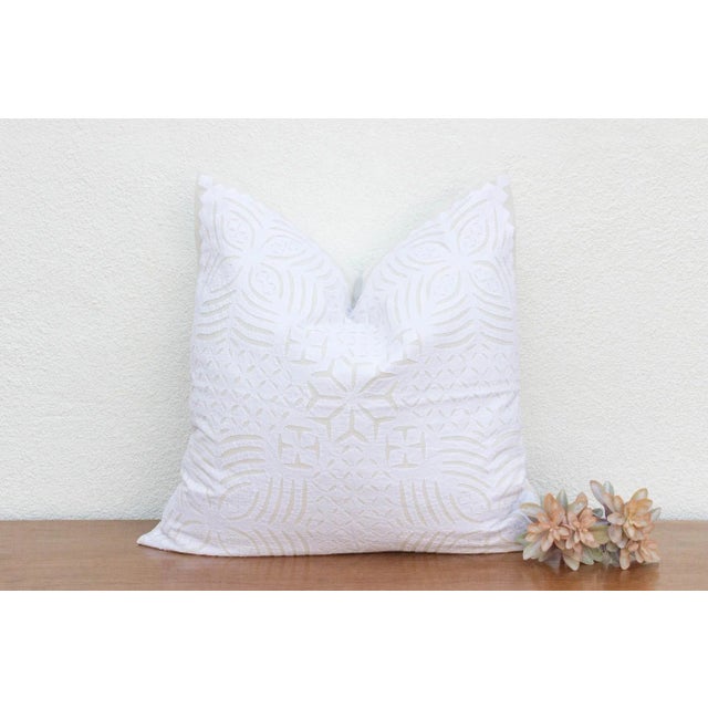 This decorative pillow cover features beautiful array of patterns, with hand crafted appliqué cut work, giving it a...