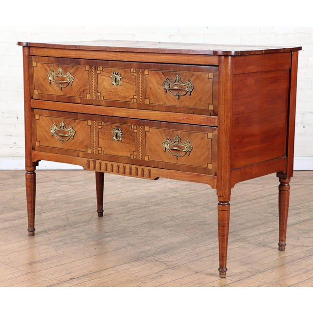 Antique French Parquetry Commode in the Neoclassic Manner featuring two drawers on elegantly tapered legs