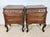 Elegant pair of French Louis XV style nightstands crafted in wood, each featuring three drawers with original brass...