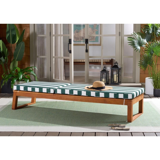 Transform your outdoor space with the Sophie Lounger in a natural and hunter green stripe. Designed for leisurely moments,...