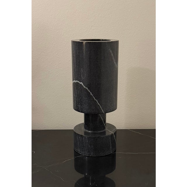 Carved from a single solid block of black marble, the Luc Vase by Citizen Artist for Global Views is a striking study in...